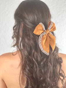 “Bow-kissed”