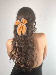 “Bow-kissed”